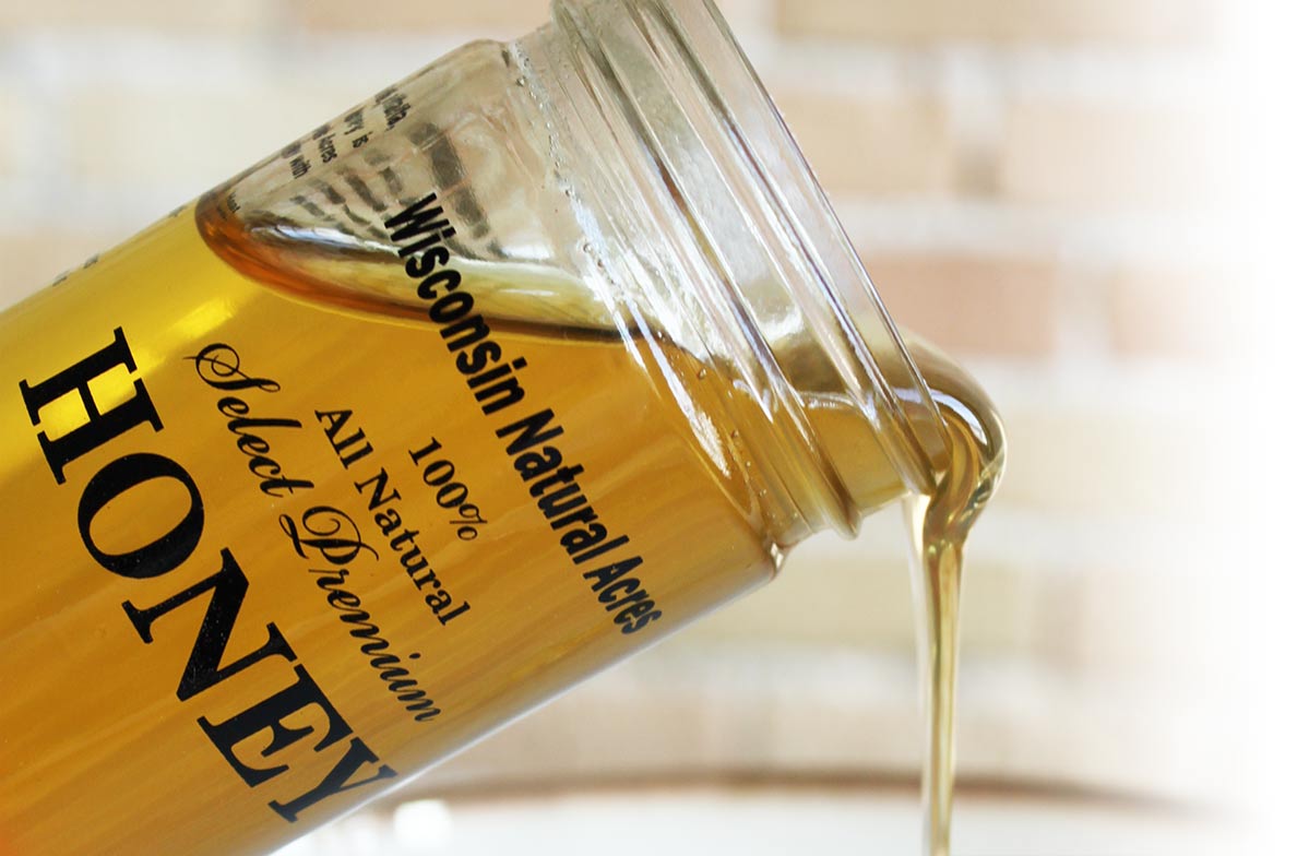 our-honey-pouring-jar-bg our-honey-pouring-jar-bg